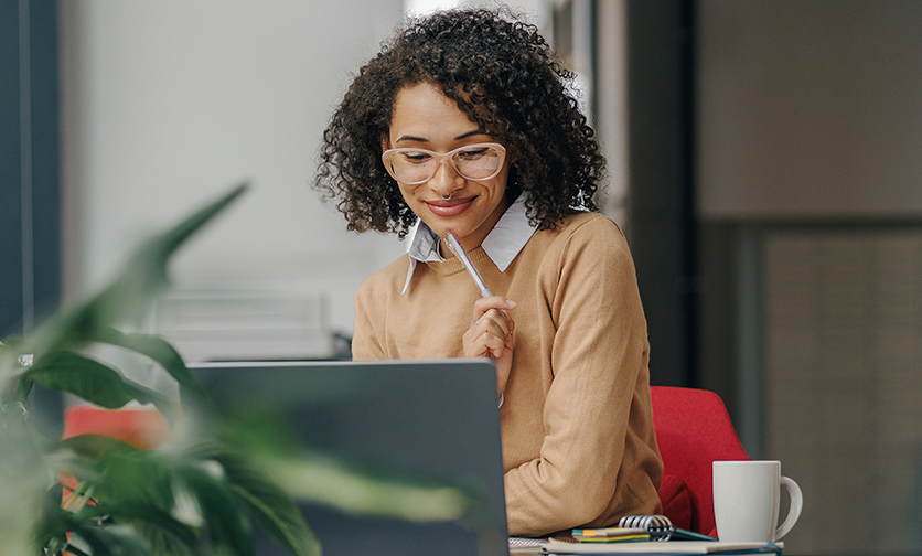 person on computer thinking
